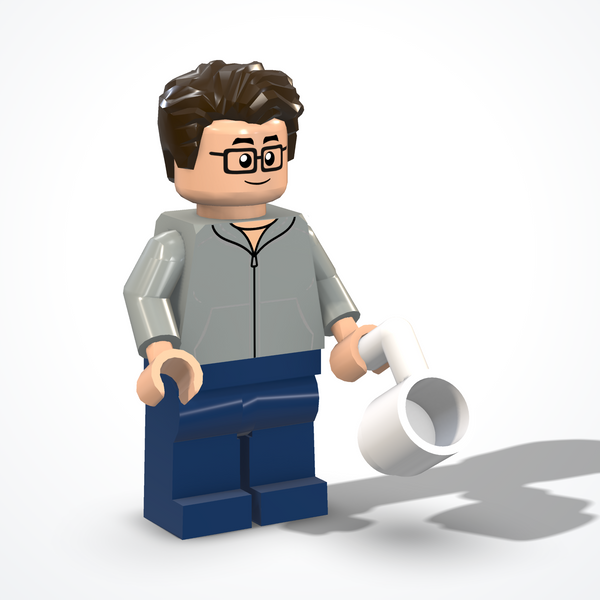Programmer figure made of construction bricks — ¾ view from the left